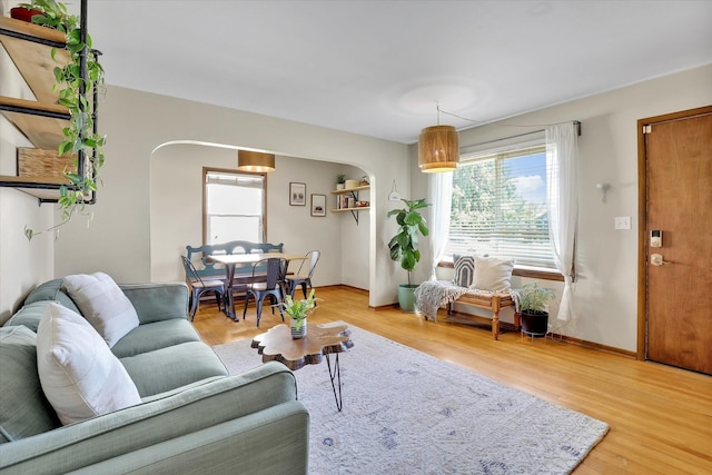 3526 W Hoffman Ave, Spokane, WA 99205 - living area featuring plenty of natural light, arched walkways, and light wood finished floors