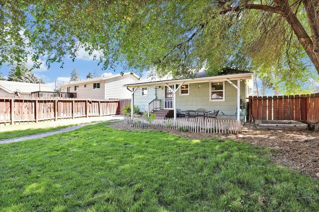 3526 W Hoffman Ave, Spokane, WA 99205 - view of front of house featuring a fenced backyard and a patio
