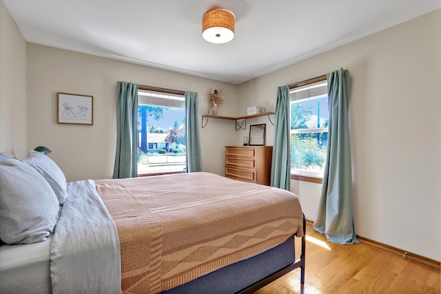 3526 W Hoffman Ave, Spokane, WA 99205 - bedroom with multiple windows and wood finished floors