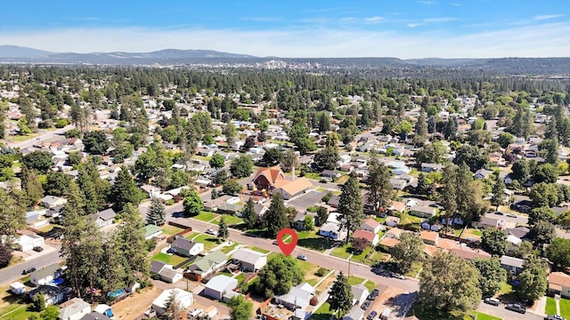 3526 W Hoffman Ave, Spokane, WA 99205 - aerial view of property and surrounding area with nearby suburban area and a mountainous background