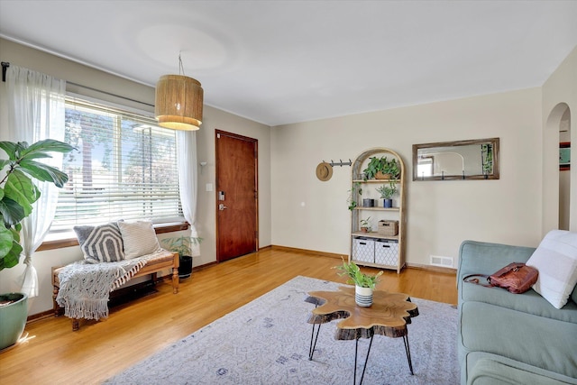 3526 W Hoffman Ave, Spokane, WA 99205 - living area with healthy amount of natural light, wood finished floors, and arched walkways
