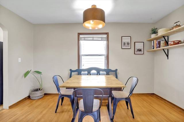 3526 W Hoffman Ave, Spokane, WA 99205 - dining room with arched walkways and light wood-type flooring