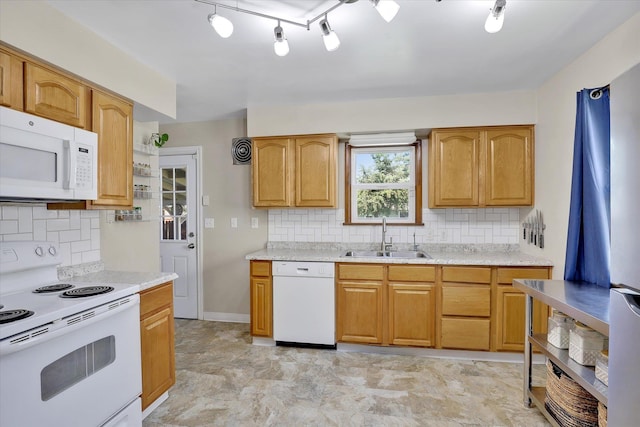 3526 W Hoffman Ave, Spokane, WA 99205 - kitchen with white appliances, backsplash, and track lighting