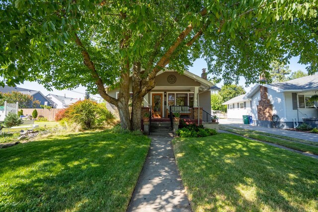617 E 34th Ave, Spokane, WA 99203 - view of front of house featuring a porch