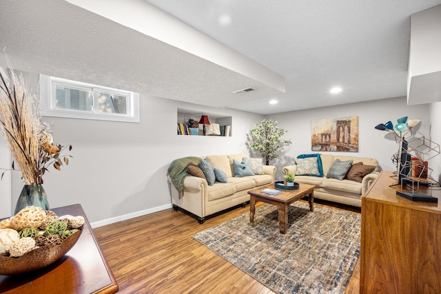 617 E 34th Ave, Spokane, WA 99203 - living area with wood finished floors, a textured ceiling, and recessed lighting