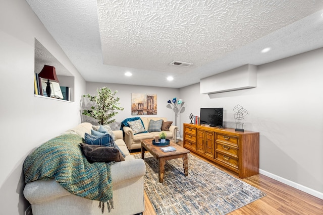 617 E 34th Ave, Spokane, WA 99203 - living area with recessed lighting, a textured ceiling, and light wood finished floors