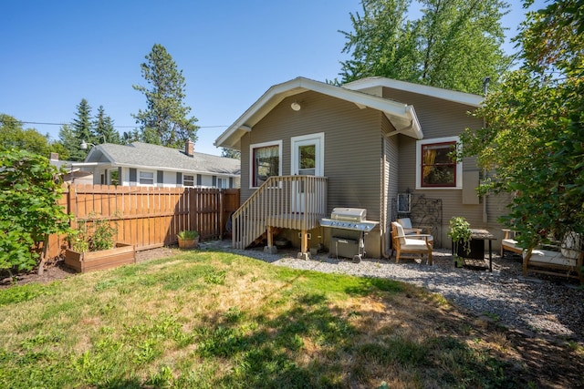 617 E 34th Ave, Spokane, WA 99203 - rear view of house featuring a vegetable garden
