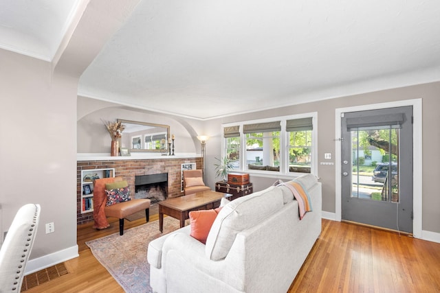 617 E 34th Ave, Spokane, WA 99203 - living area featuring light wood finished floors and a fireplace