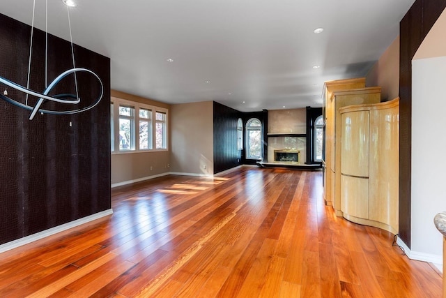 2010 E Pinecrest Rd, Spokane, WA 99203 - unfurnished living room with healthy amount of natural light, wood finished floors, a fireplace, and recessed lighting