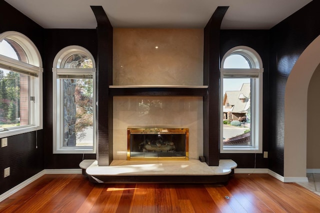 2010 E Pinecrest Rd, Spokane, WA 99203 - detailed view of wood finished floors, a tile fireplace, and arched walkways