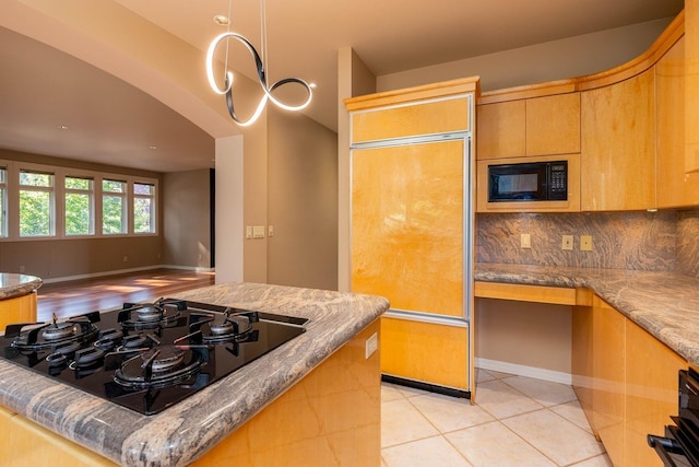 2010 E Pinecrest Rd, Spokane, WA 99203 - kitchen featuring black appliances, decorative backsplash, and stone countertops