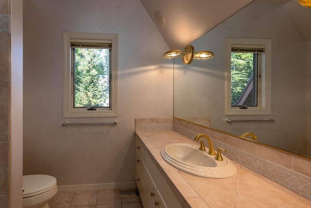 2010 E Pinecrest Rd, Spokane, WA 99203 - bathroom with vaulted ceiling, vanity, and tile patterned floors