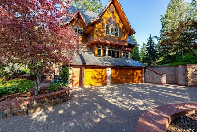 2010 E Pinecrest Rd, Spokane, WA 99203 - view of front facade featuring driveway and an attached garage