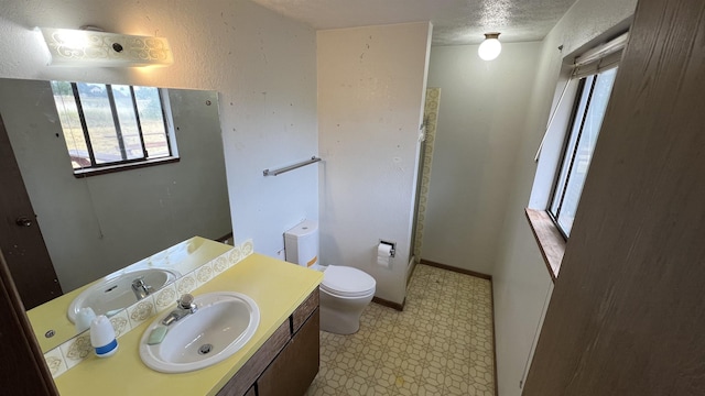 3520 N Arden Rd, Otis Orchards, WA 99027 - bathroom with tile patterned floors, vanity, and a textured ceiling