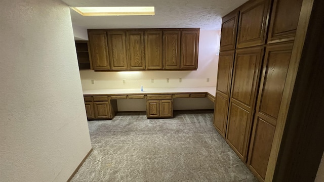 3520 N Arden Rd, Otis Orchards, WA 99027 - unfurnished office featuring light colored carpet, built in study area, a textured wall, and a textured ceiling