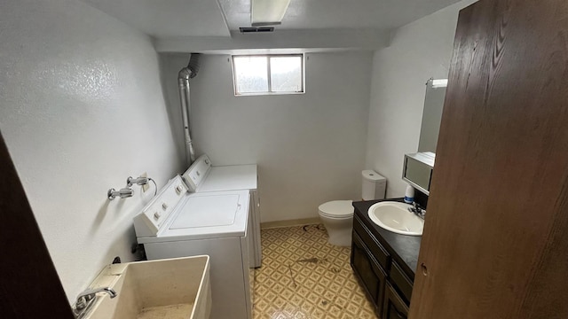 3520 N Arden Rd, Otis Orchards, WA 99027 - full bathroom featuring washer and dryer, tile patterned floors, and vanity
