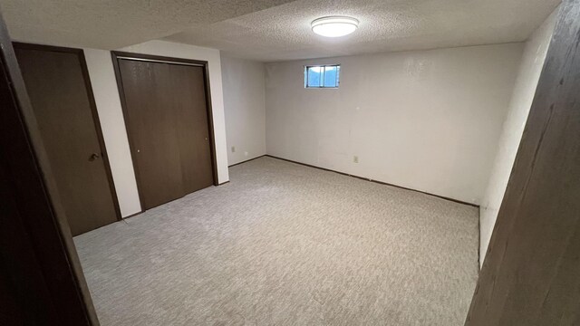 3520 N Arden Rd, Otis Orchards, WA 99027 - basement with a textured ceiling and light colored carpet