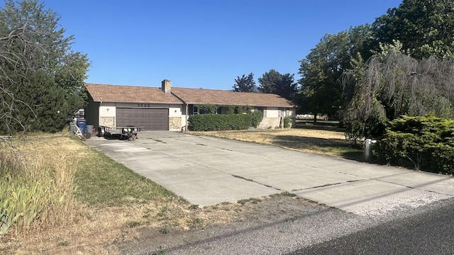 3520 N Arden Rd, Otis Orchards, WA 99027 - ranch-style home with a garage, a chimney, and concrete driveway