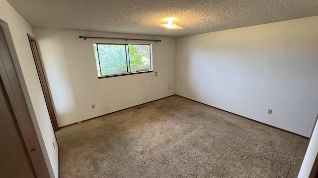 3520 N Arden Rd, Otis Orchards, WA 99027 - carpeted spare room with a textured ceiling and baseboards