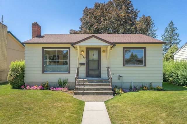 5327 N Jefferson St, Spokane, WA 99205 - bungalow-style house featuring a chimney, a front lawn, and roof with shingles