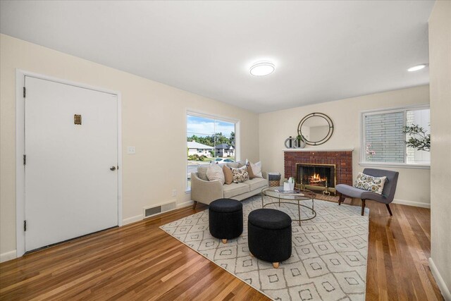 5327 N Jefferson St, Spokane, WA 99205 - living area with wood finished floors and a brick fireplace