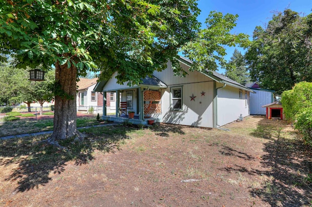 3222 W 4th Ave, Spokane, WA 99224 - ranch-style home featuring covered porch and an outdoor structure