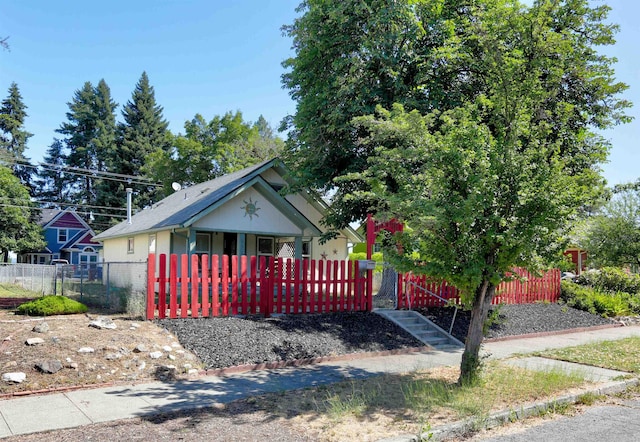 3222 W 4th Ave, Spokane, WA 99224 - view of front of property with a fenced front yard, brick siding, a gate, and a porch