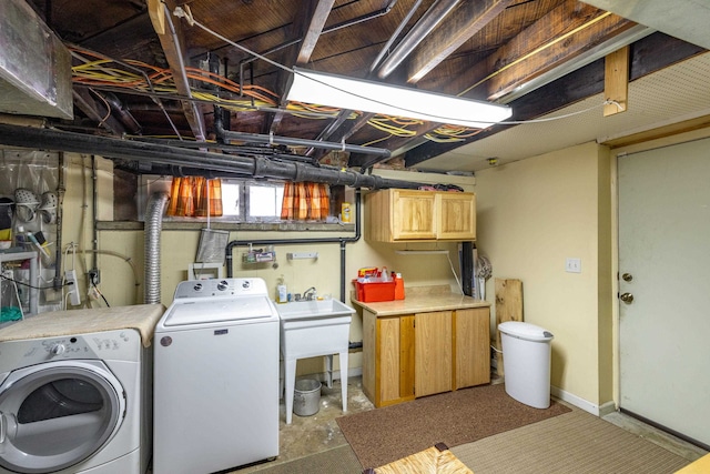 814 E Montgomery Ave, Spokane, WA 99207 - washroom featuring washer and dryer and cabinet space