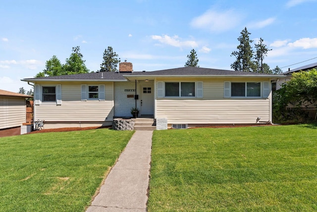 4017 E Pratt Ave, Spokane, WA 99204 - view of front of house with a chimney and a front yard