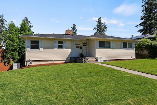 4017 E Pratt Ave, Spokane, WA 99204 - view of front of house featuring a chimney and a front lawn