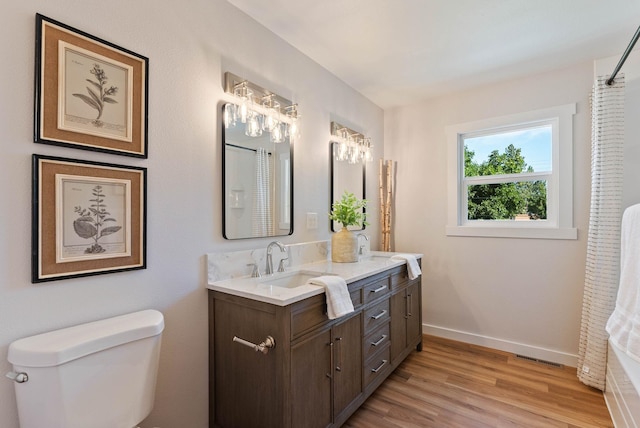 4017 E Pratt Ave, Spokane, WA 99204 - bathroom with double vanity, wood finished floors, and curtained shower