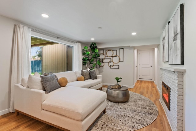 4017 E Pratt Ave, Spokane, WA 99204 - living room with light wood-style flooring, recessed lighting, and a fireplace