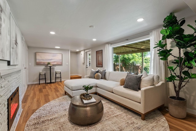 4017 E Pratt Ave, Spokane, WA 99204 - living room featuring wood finished floors, a fireplace, and recessed lighting