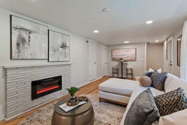 4017 E Pratt Ave, Spokane, WA 99204 - living room with a glass covered fireplace, wood finished floors, and recessed lighting