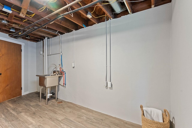 4017 E Pratt Ave, Spokane, WA 99204 - unfinished basement with wood finished floors and a sink