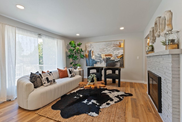 4017 E Pratt Ave, Spokane, WA 99204 - living room featuring light wood finished floors, recessed lighting, and a brick fireplace