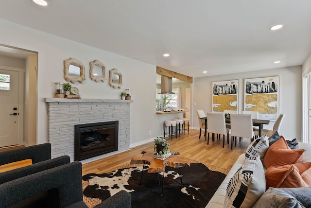 4017 E Pratt Ave, Spokane, WA 99204 - living room with wood finished floors, recessed lighting, and a stone fireplace