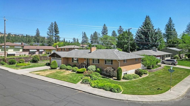 4335 W Excell Ave, Spokane, WA 99208 - single story home with concrete driveway, a front yard, a chimney, brick siding, and a garage