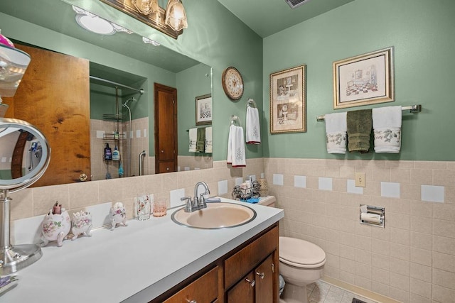 4335 W Excell Ave, Spokane, WA 99208 - full bath with tiled shower, vanity, tile walls, tile patterned floors, and wainscoting