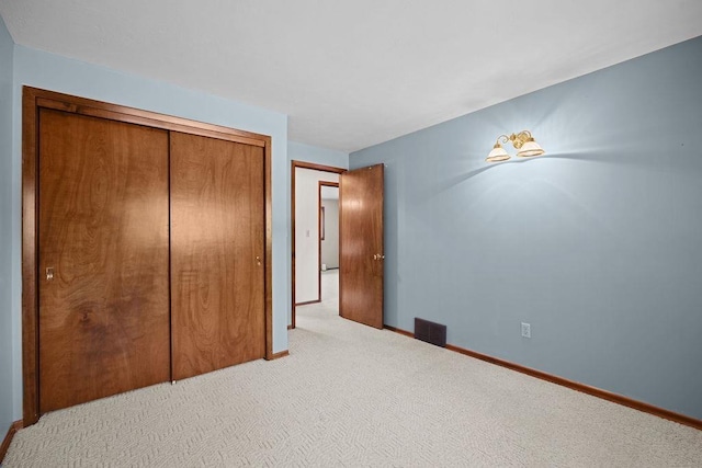 4335 W Excell Ave, Spokane, WA 99208 - unfurnished bedroom featuring light carpet and a closet