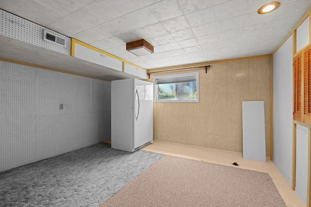 4335 W Excell Ave, Spokane, WA 99208 - below grade area featuring freestanding refrigerator and carpet floors
