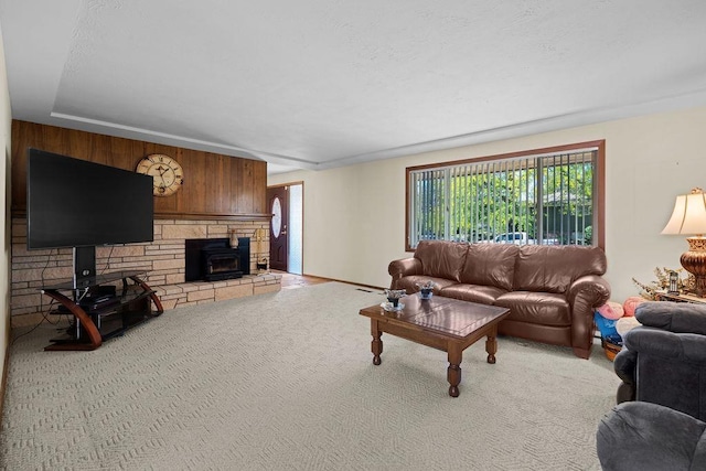 4335 W Excell Ave, Spokane, WA 99208 - living room with wooden walls, a wood stove, and light colored carpet