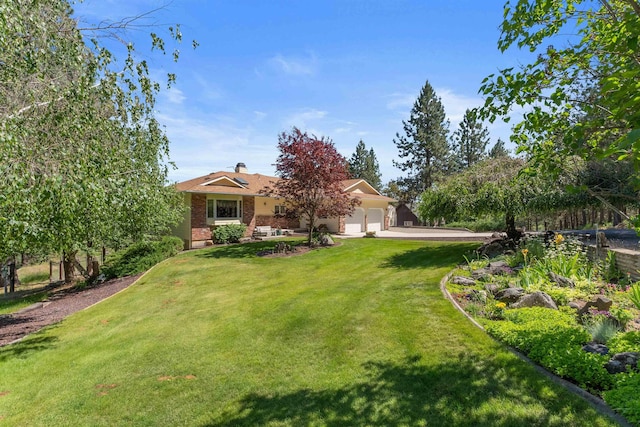 3314 W Eagles Nest Ln, Spokane, WA 99208 - view of front facade featuring a garage, a front lawn, brick siding, and driveway