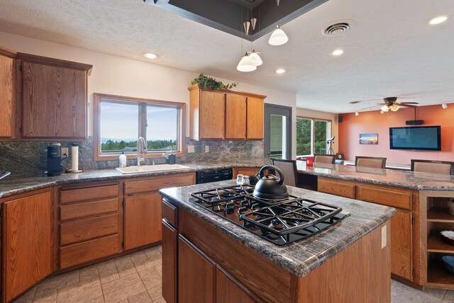 3314 W Eagles Nest Ln, Spokane, WA 99208 - kitchen with black appliances, a center island, tasteful backsplash, recessed lighting, and ceiling fan
