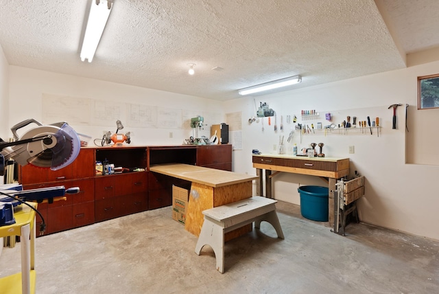 3314 W Eagles Nest Ln, Spokane, WA 99208 - misc room featuring a workshop area, concrete floors, and a textured ceiling