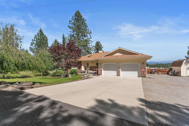 3314 W Eagles Nest Ln, Spokane, WA 99208 - ranch-style home featuring an attached garage, concrete driveway, brick siding, a chimney, and a front lawn