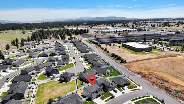 1119 S Soda Rd, Spokane, WA 99224 - aerial view of property and surrounding area with a mountain backdrop and nearby suburban area
