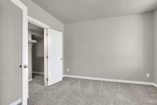 1119 S Soda Rd, Spokane, WA 99224 - unfurnished bedroom featuring carpet flooring and a walk in closet