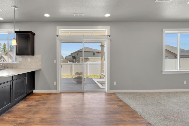 1119 S Soda Rd, Spokane, WA 99224 - unfurnished dining area with plenty of natural light, recessed lighting, wood finished floors, and a textured ceiling