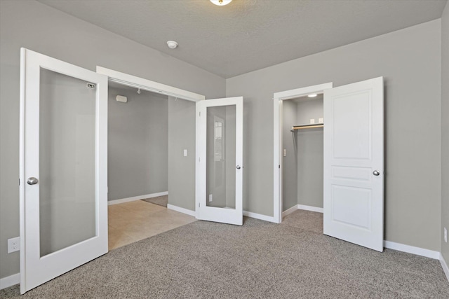 1119 S Soda Rd, Spokane, WA 99224 - unfurnished bedroom with carpet flooring, french doors, and a closet